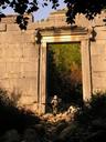 Ashe passing through one of Olympos most impressive sights, the ancient temple gate.