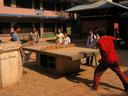 Walking through the lanes of southern Kathmandu in the Teku district, we found some kids playing ping pong on a table of concrete and net made of bricks. Maciej couldnt help but join the game.